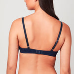 Back view of model wearing a midnight blue Liberté Crosby Plunge Bra featuring a Crosby performance micro jersey band.