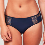 Model wearing a Liberté Crosby Mid Rise Hipster in midnight blue, featuring Crosby performance micro jersey and lace insets.