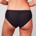 Back view of curve model wearing a Liberté Crosby Mid Rise Hipster in black featuring Crosby performance micro jersey and lace insets.