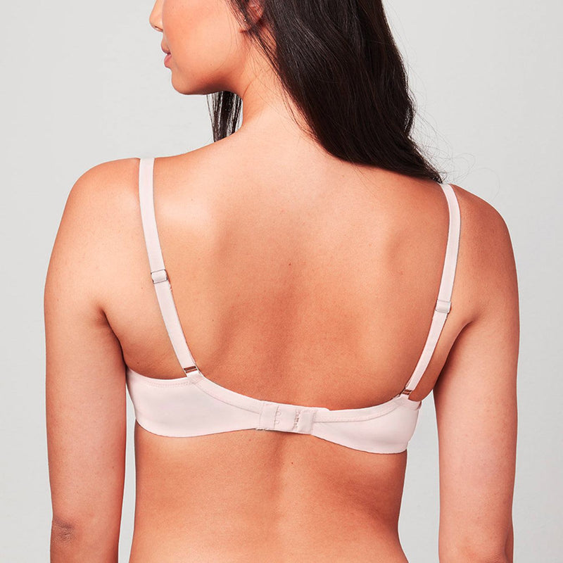 Back view of model wearing a Blush pink Liberté Crosby Demi Bra featuring a Crosby performance micro jersey band.