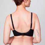 Back view of model wearing a black Liberté Crosby Demi Bra featuring a Crosby performance micro jersey band.