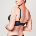 Back view of model wearing Midnight blue Liberté Bowery Mesh Plunge bra featuring a sheer power mesh band.