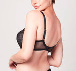 Back view of model wearing a black Liberté Bowery Mesh Plunge bra featuring a sheer power mesh band.